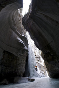 Female Climber Ice Climbing in Maligne Canyon Poster Print