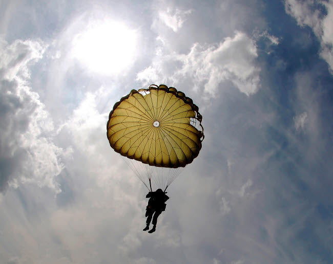 A Paratrooper Descends Through the Sky Fine Art Print by Stocktrek Images