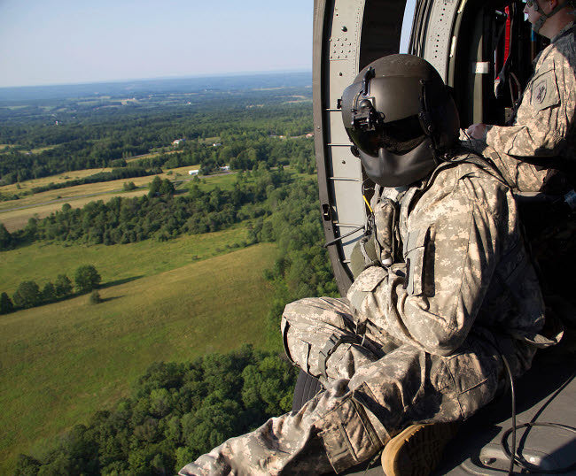 Army Crew Chief in UH-60 Black Hawk Helicopter Fine Art Print by Stocktrek Images