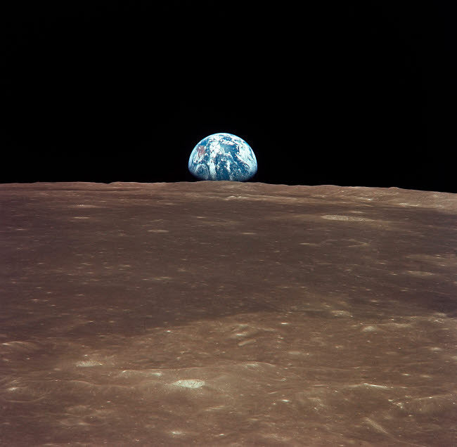 Earth Rising Above the Moon's Horizon Fine Art Print by Stocktrek Images
