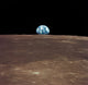 Earth Rising Above the Moon's Horizon Fine Art Print by Stocktrek Images