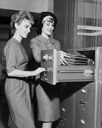 Two Female Office Workers Organizing Files Fine Art Print