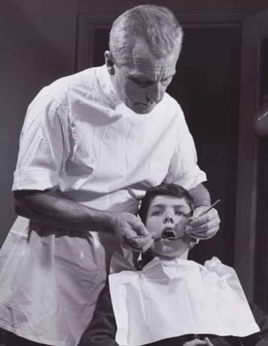 Male Dentist Examining a Boy's Teeth Fine Art Print