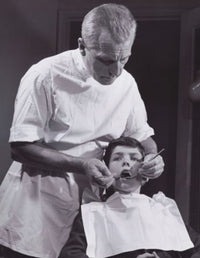 Male Dentist Examining a Boy's Teeth Fine Art Print