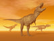 Three Tyrannosaurus Rex Dinosaurs in an Orange Foggy Desert by Sunset Fine Art Print