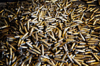 Empty 762mm Brass Casings Fine Art Print by Andrew Chittock