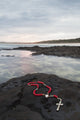 A Cross and Rosary Beads on a Rock - Fine Art Print by Marcos Welsh