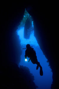 A Diver Explores the Bat Cave Underwater Cavern Fine Art Print