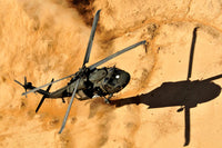 A UH-60 Black Hawk Helicopter Landing Fine Art Print by Stocktrek Images