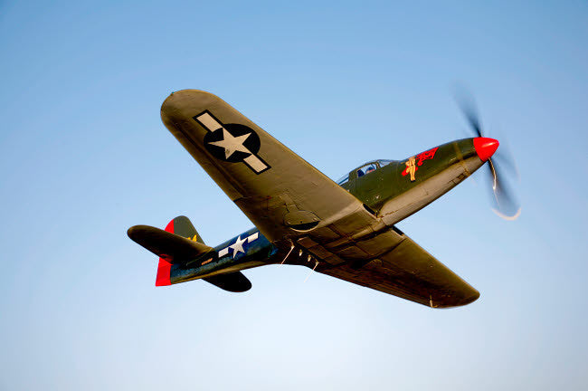 A Bell P-63 Kingcobra in Flight Fine Art Print by Scott Germain