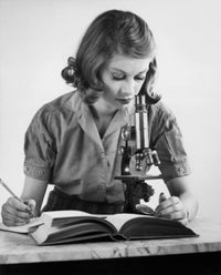 Teenage Girl Looking Through a Microscope Fine Art Print
