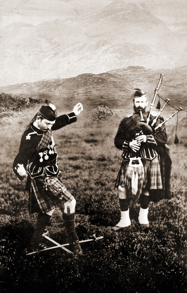 Two Men in Kilts Dance Over Swords with Bagpipe Playing Fine Art Print