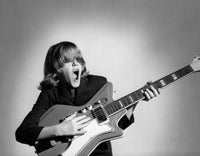 Teenage Boy Playing Guitar and Singing Fine Art Print