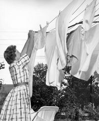 Young Woman Hanging Clothes on a Clothesline Fine Art Print