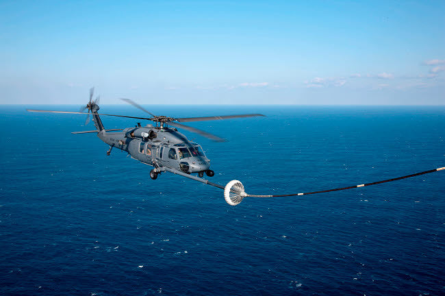 An HH-60 Pave Hawk Refueling Over the Pacific Ocean Fine Art Print by Stocktrek Images