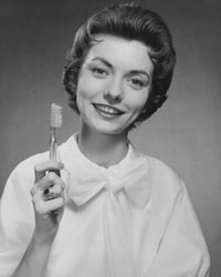 Portrait of a Young Woman Holding a Toothbrush Fine Art Print
