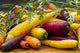 Variety of Colorful Fresh Carrots on Wooden Surface Fine Art Print by Michael Interisano