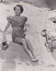 Joan Crawford Sitting on Beach Towel Photo Print