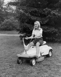 Young Woman Riding a Lawn Mower Fine Art Print