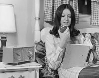 Teenage Girl Eating an Apple and Reading a Book Fine Art Print