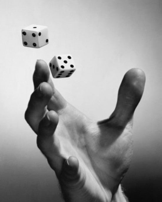 Close-Up of a Hand Tossing Two Dice Fine Art Print