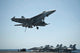 F/A-18E Super Hornet Fine Art Print Over USS Nimitz by Stocktrek Images
