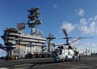 A Russian Navy KA-27 Helix Helicopter Landing on USS Nimitz Fine Art Print by Stocktrek Images