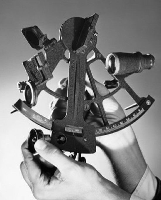 Close-up of a Man's Hand Holding a Sextant Fine Art Print