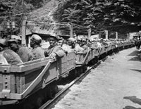 Group of Miners Going into a Mine on Carts Fine Art Print