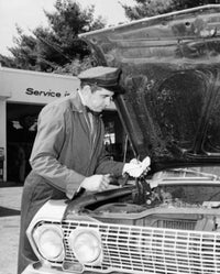Auto Mechanic Repairing Car at Service Station Fine Art Print