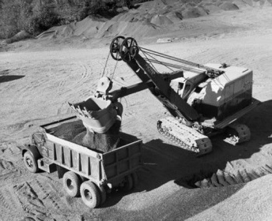 Excavator Loading Rock Dirt into Dump Truck Fine Art Print