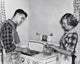 Teenage Couple Cooking Hamburgers on a Stove Fine Art Print