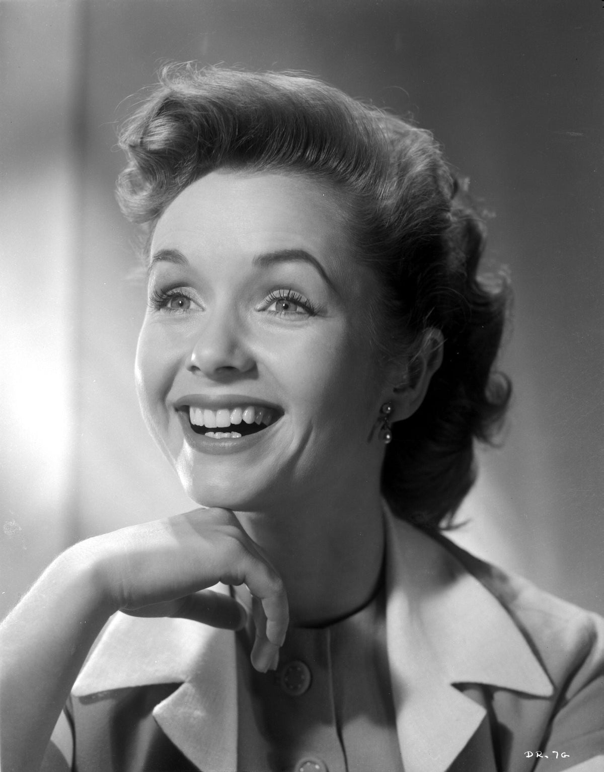 Debbie Reynolds smiling in trench coat photo print