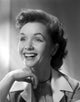 Debbie Reynolds smiling in trench coat photo print