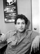 Photo print of Harvey Fierstein seated in a restaurant.