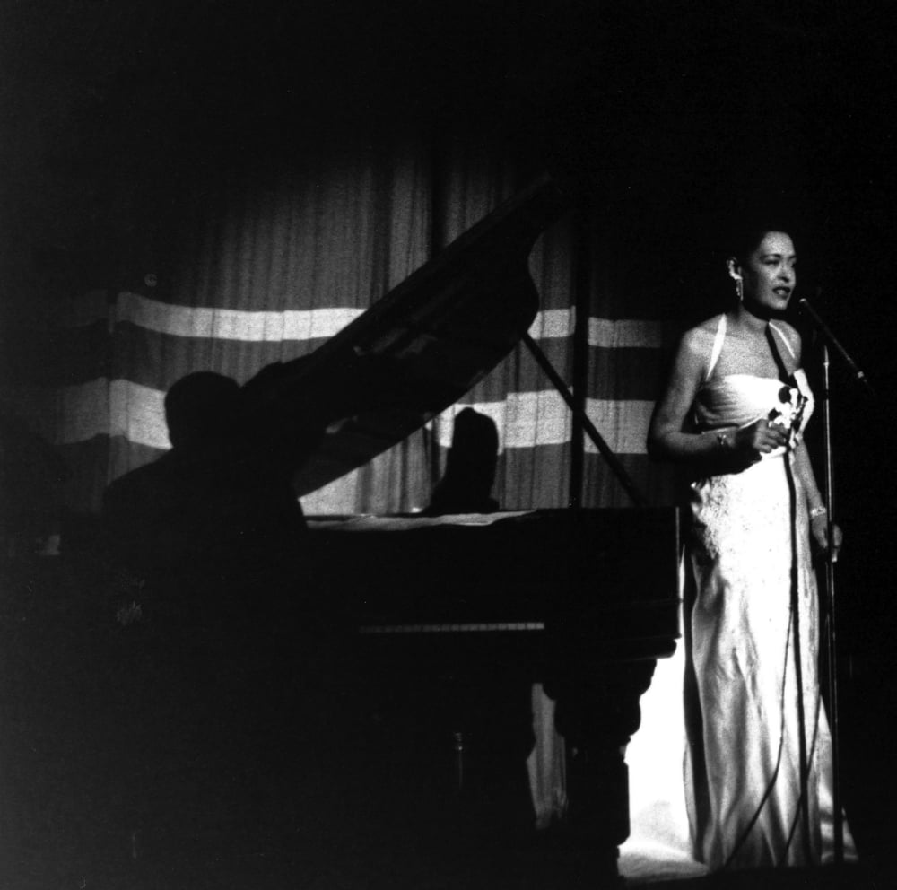 Billie Holiday performing on stage photo print, capturing the essence of jazz.