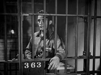 Bing Crosby posed in jail wearing a prisoner uniform portrait photo print