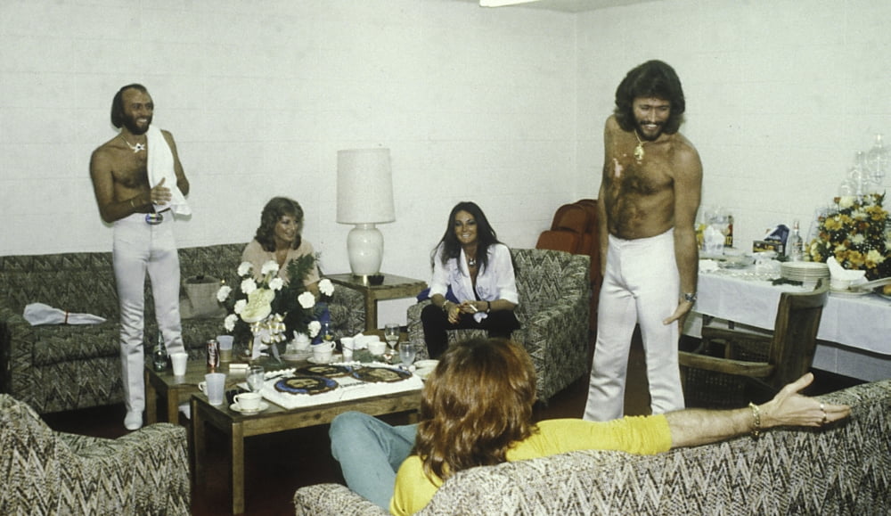 The Bee Gees photo print featuring two women in a living room setting, available in multiple sizes.