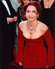 Gloria Estefan photo print in a striking red strapless dress.
