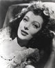Loretta Young portrait lying with curly hair photo print