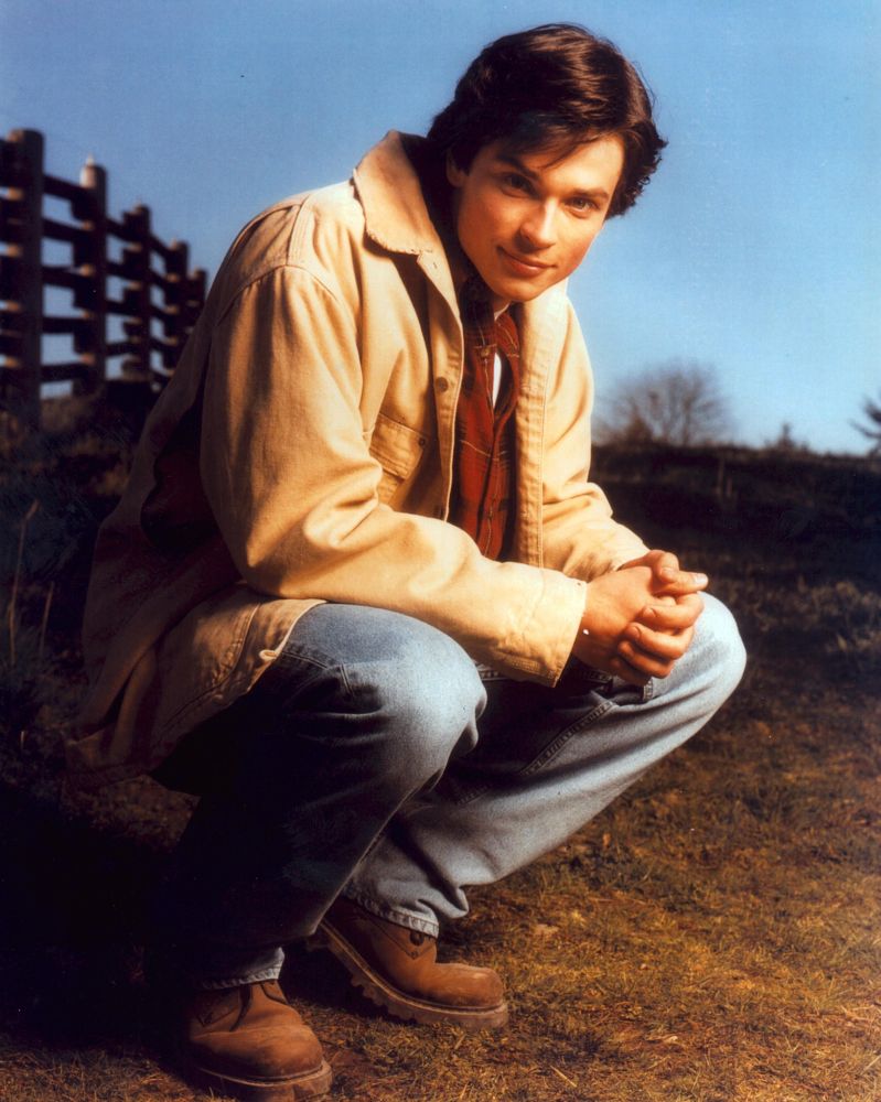 Tom Welling Squatting by Fence Photo Print