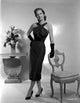 Vera Miles standing in a black ankle length halter dress photo print