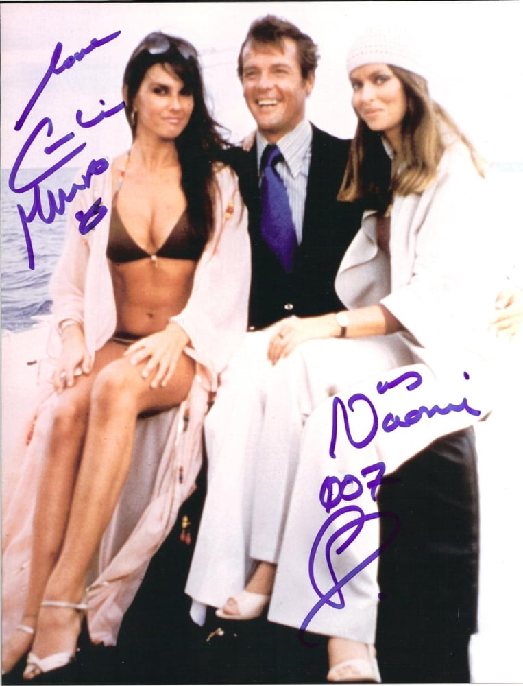 Caroline Munro sitting on Roger Moore's lap photo print.
