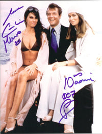 Caroline Munro sitting on Roger Moore's lap photo print.