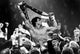 Sylvester Stallone carried by men holding a flag photo print.