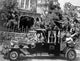 The Munsters family looking serious in a vintage car photo print.