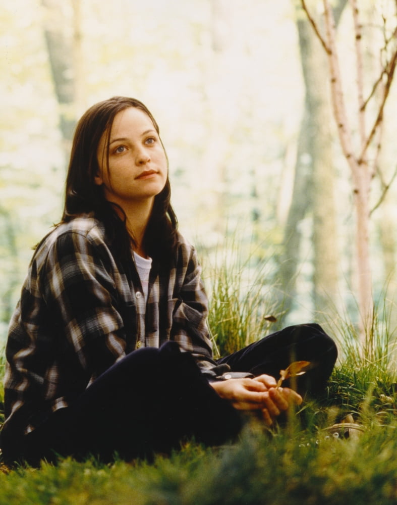 Alison Elliott sitting on grass in checkered long sleeves photo print