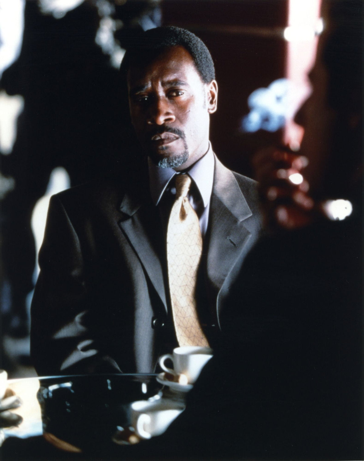 Don Cheadle photo print featuring the actor in a gray coat.