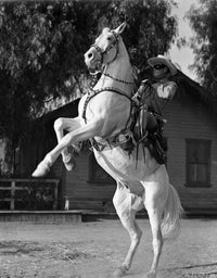 Lone Ranger riding a horse in cowboy attire photo print