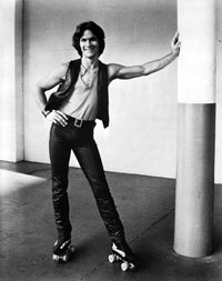 Patrick Swayze roller skates photo print showcasing iconic actor.